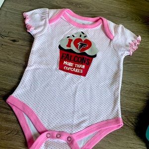 Atlanta Falcons girls short sleeve bodysuit. Pink polkadots on white bodysuit